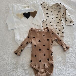 Rabbit + Bear 0-3 mo. Long-sleeved onesies, brown and white w/hearts.